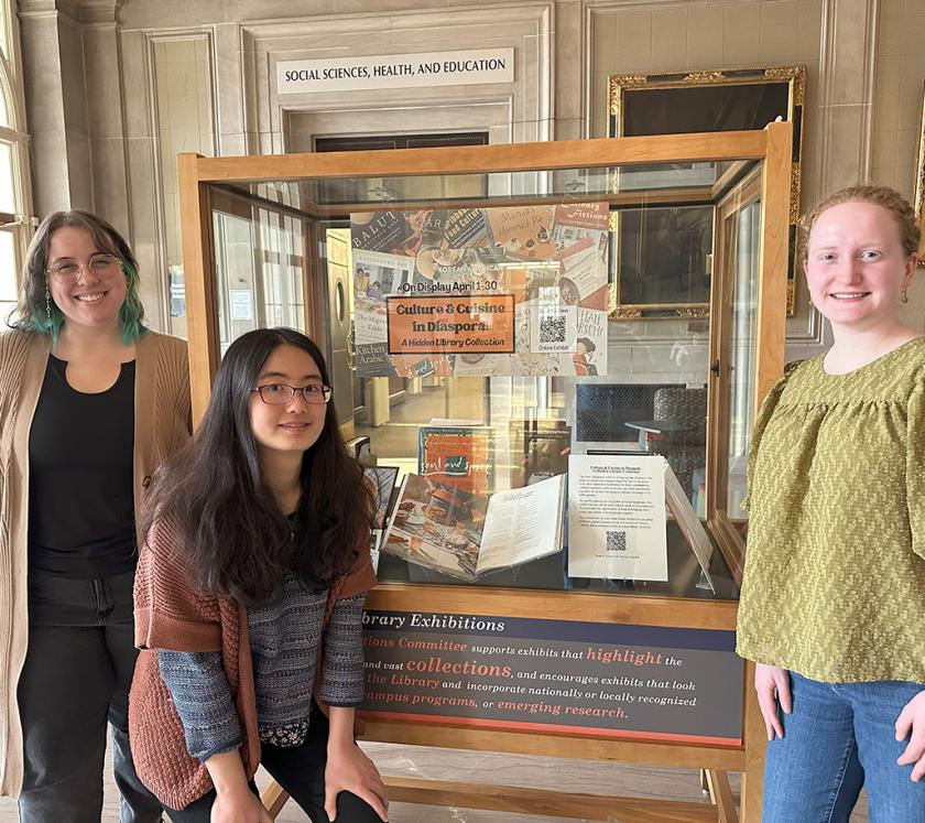 MSLIS students Yung-hui Chou, Alice Tierney-Fife, and Elizabeth Workman stand next to the winning exhibit