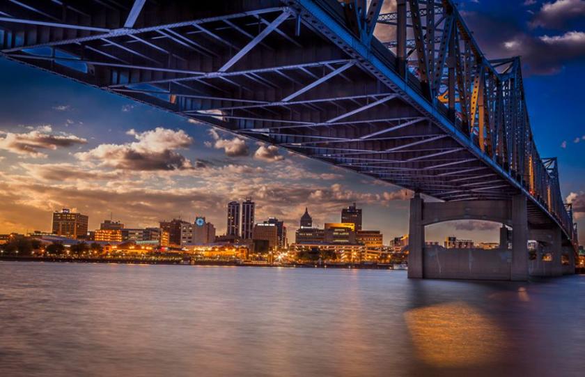 Image of the Peoria, Illinois skyline from under a bridge at sunset