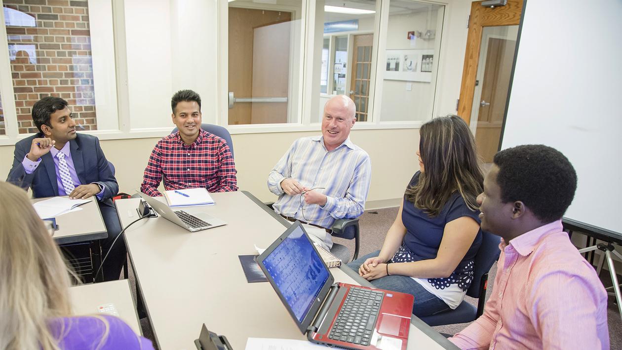 Mike Twidale with students in classroom