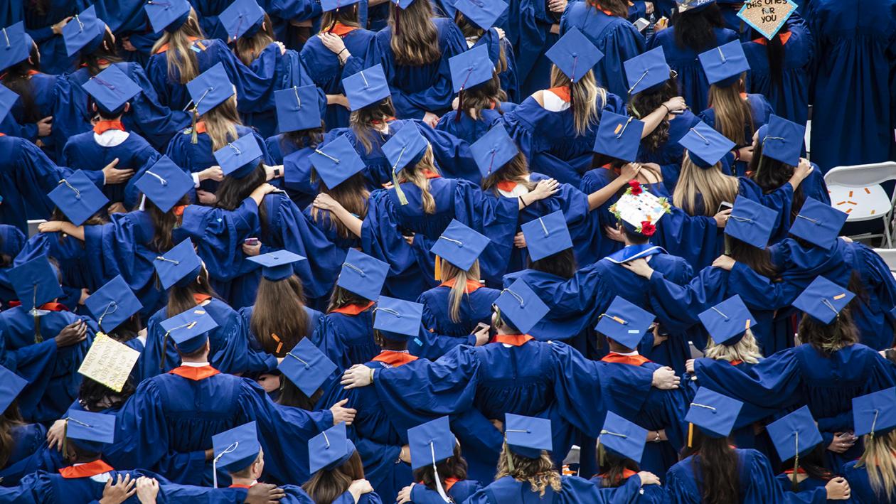 graduates at commencement