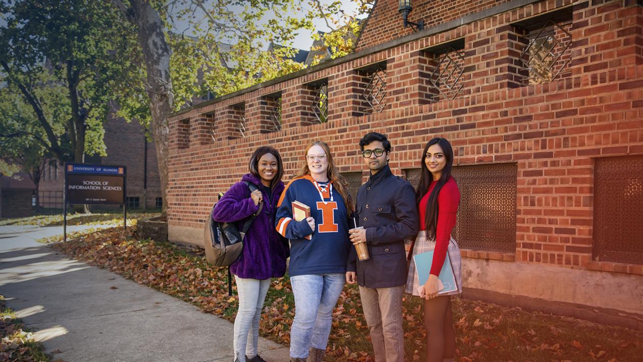 Students standing outside the iSchool building