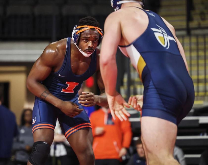 Isiah Pettigrew wrestles an opponent during an Illini wrestling match.