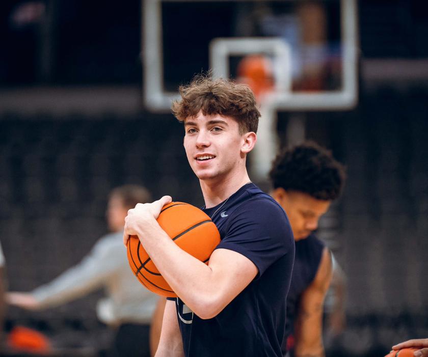 John Kramer holding a basketball