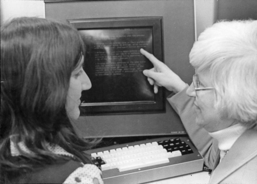 Professor Henderson instructs a cataloging student in 1974. [Photo courtesy of the U of I Archives.]