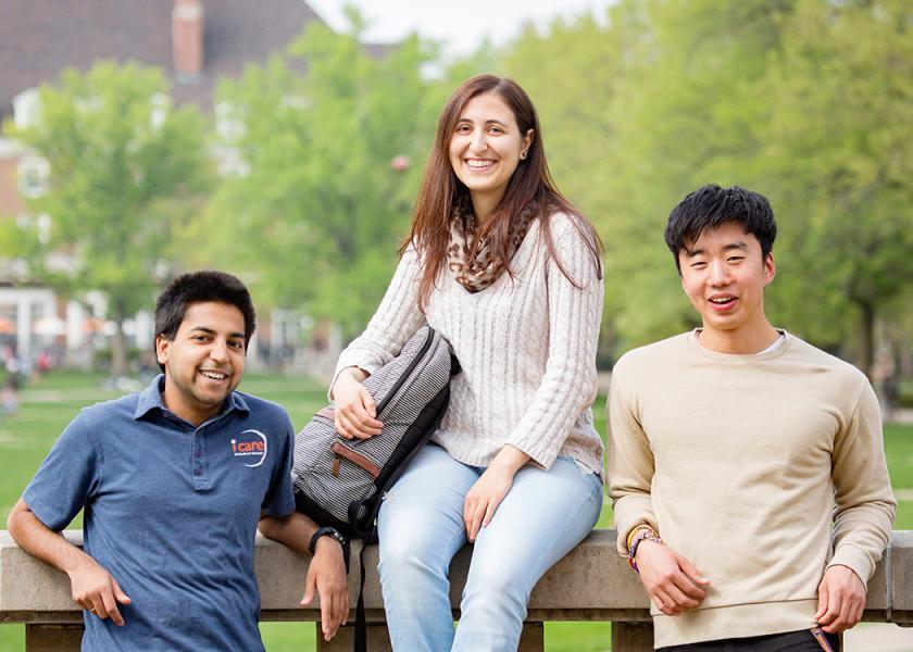 Students pose on the patio of Foellinger Auditorium