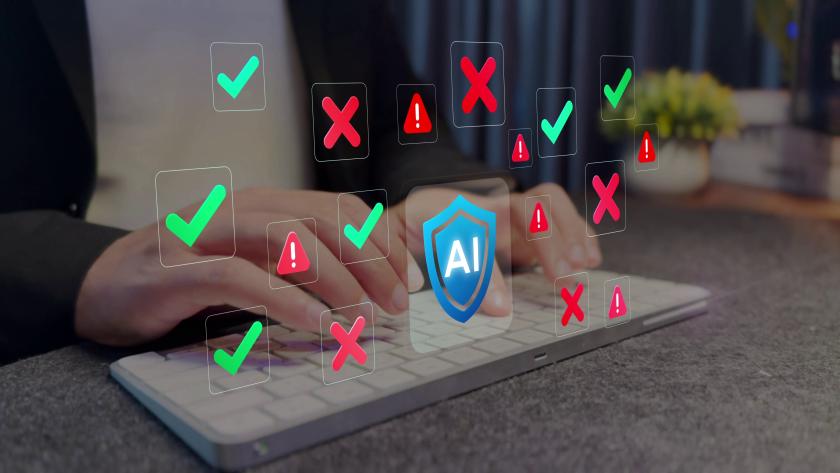 Photo of hands typing on keyboard with illustrations of checks and x marks to illustrate AI safety