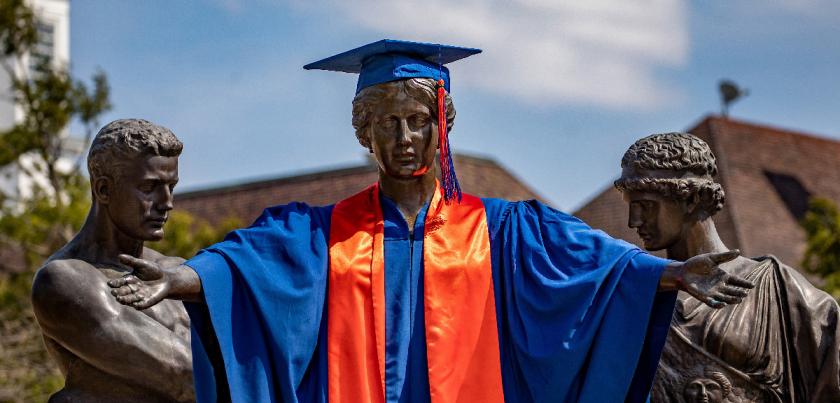 Alma Mater in cap and gown