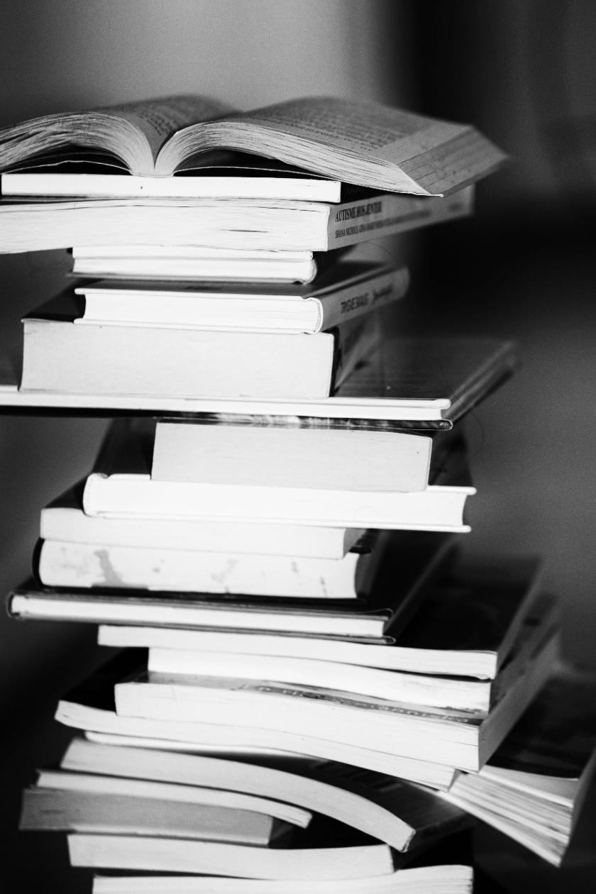 black & white photo of book stack