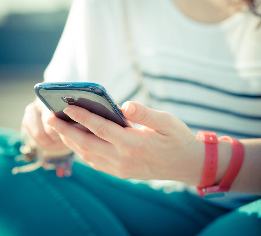 young woman uses a smartphone