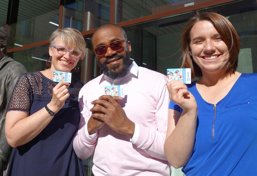 Knutson & students with library cards in Russia