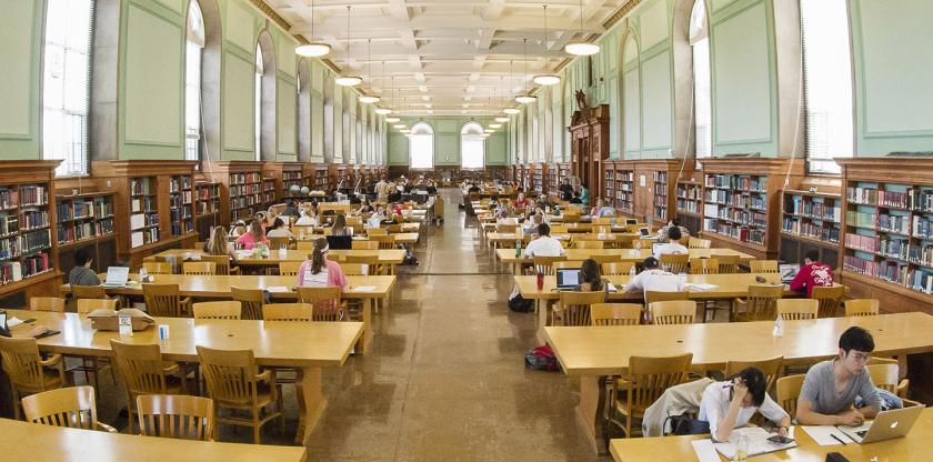 students studying in the reference room of the University Library