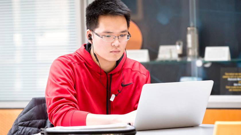 student working on laptop