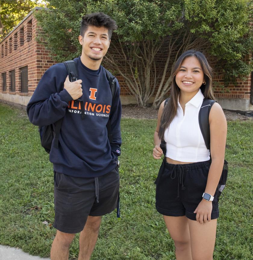 BSIS students beside the iSchool building