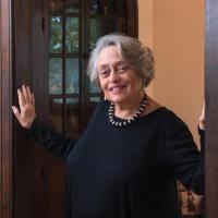 Barbara Ford smiles in her doorway