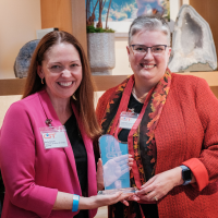 Kelly Desino, Scientific Director of AbbVie's Community of Science, presenting the Synergy Award from the Chicago Council on Science and Technology (C2ST) to Professor Cathy Blake.