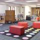 inside the Center for Children's Books with colorful furniture and carpet and bookcases.