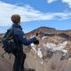 Alex Soja looks into the distance atop a moutain in Japan